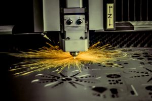 CNC Laser cutting of metal, modern industrial technology. .
