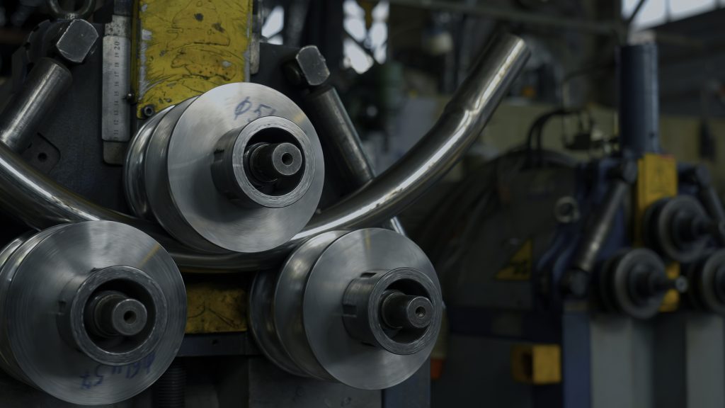 Industrial bender equipment machine for metal pipe bending in the factory. Creative. Automatic metalworking machine.