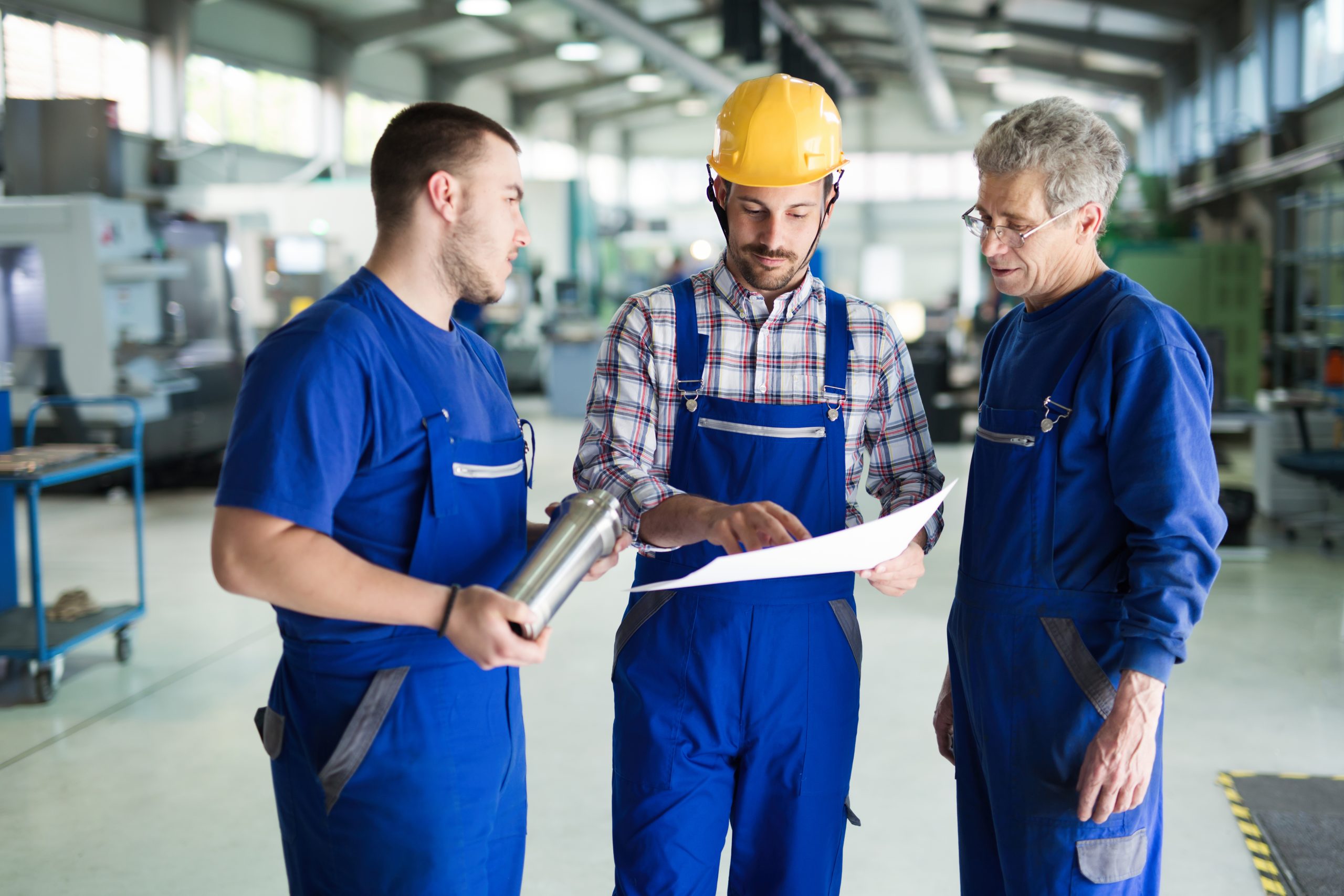 Portrait of an handsome engineer in a factory