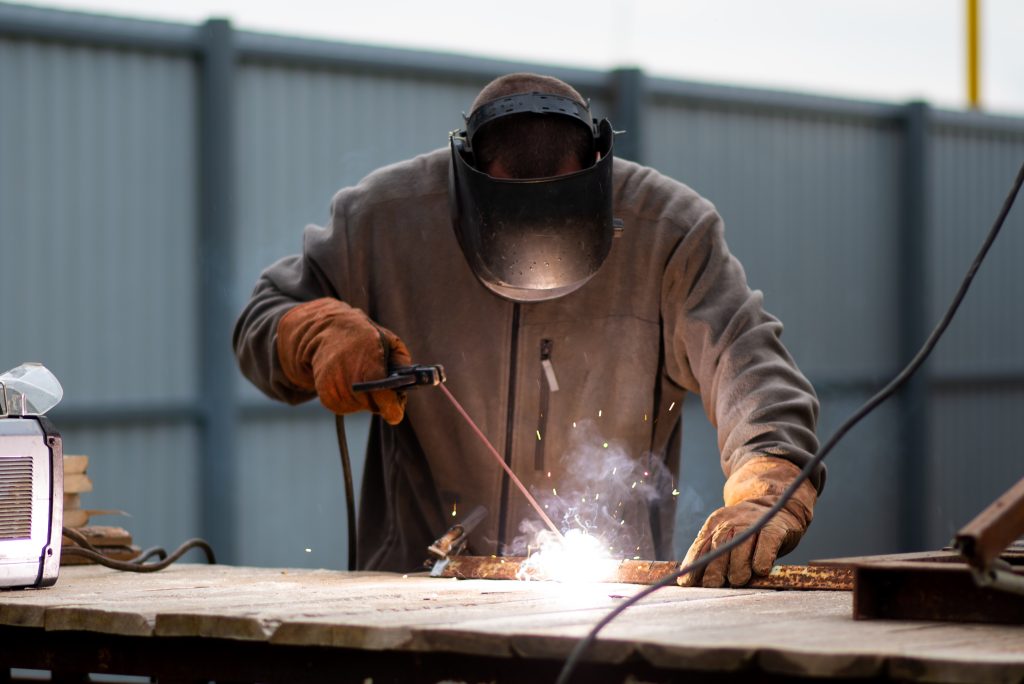 man welding