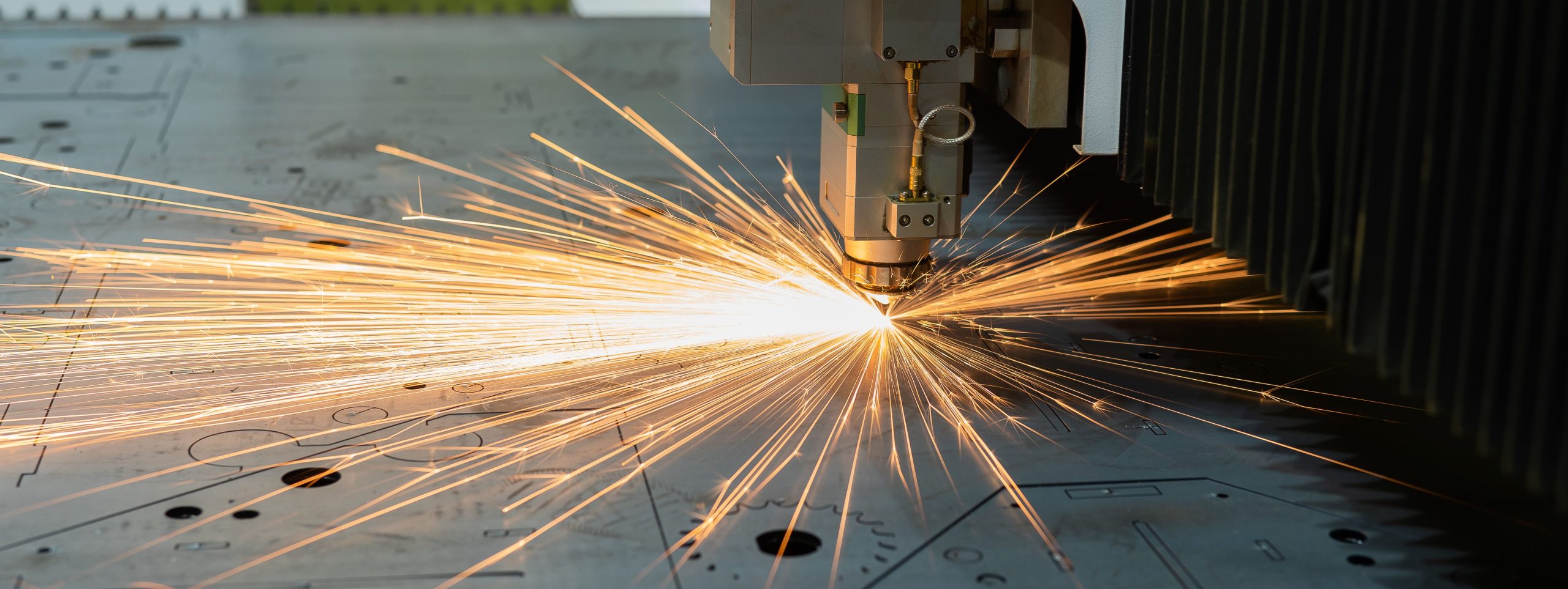 CNC machine. Laser cutting of metal. Sparks.