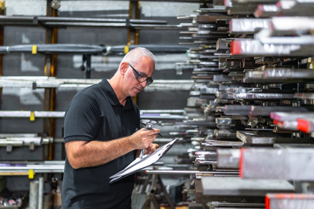 Man doing quality control inventory in the factory