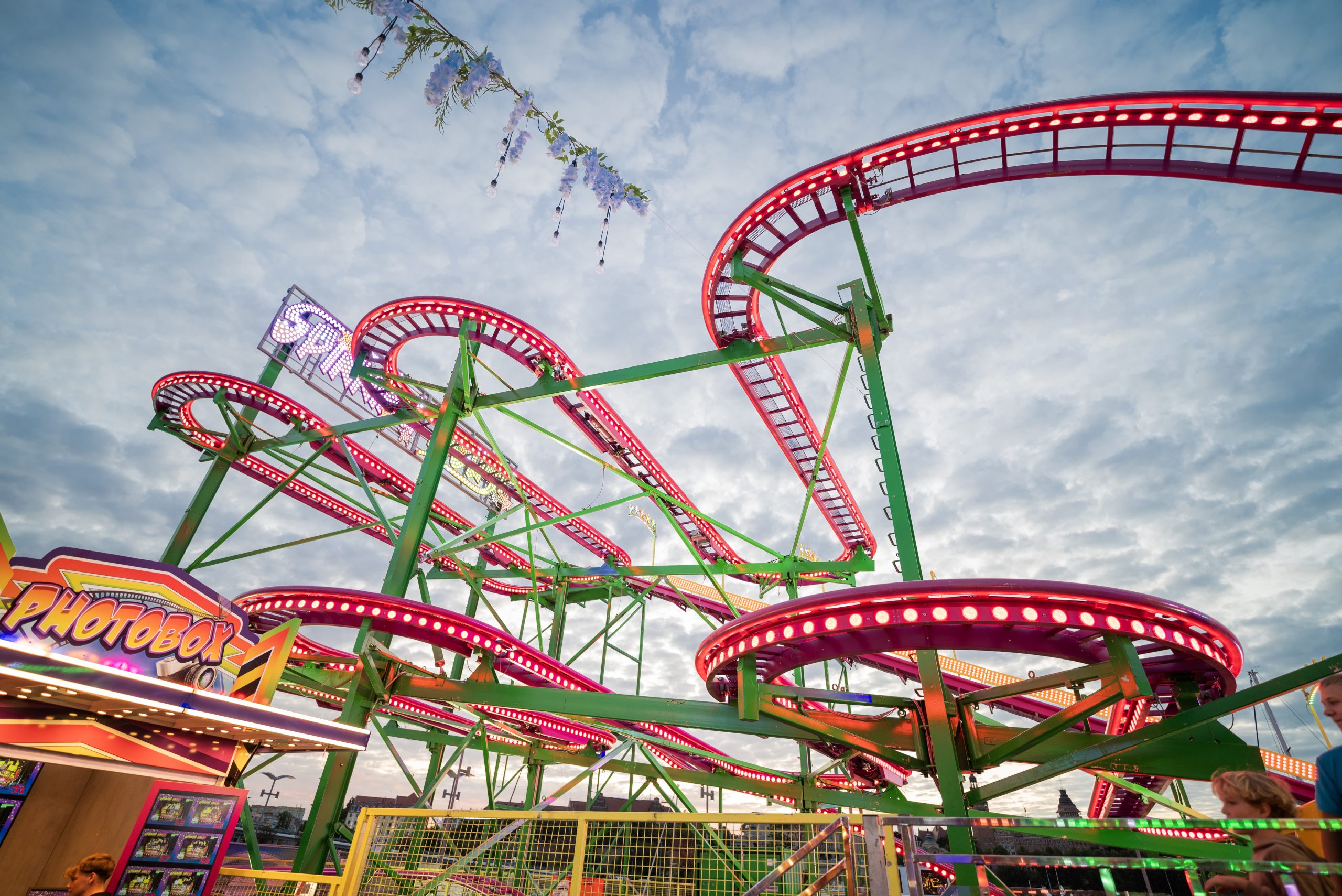 View of the landmark Holiday Amusement Park roller coaster rides at sunset
