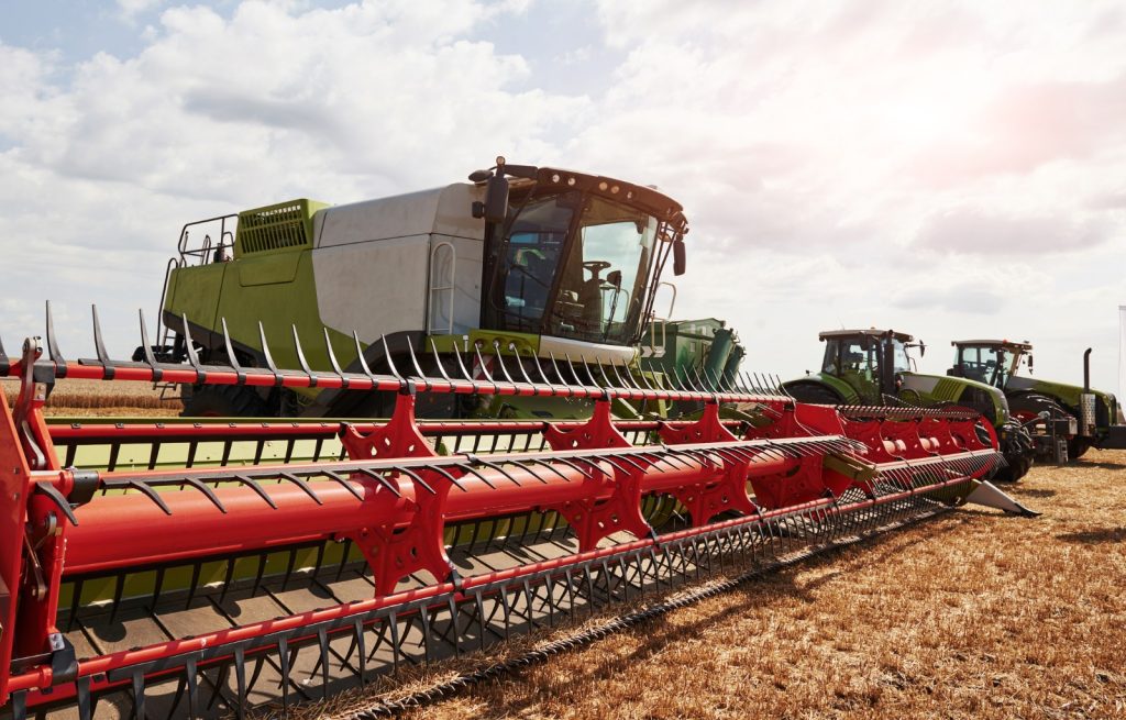 Large combine harvesters showing fabricated tubing