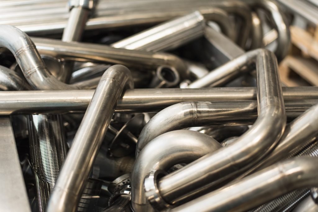 bent and fabricated tubes in bin